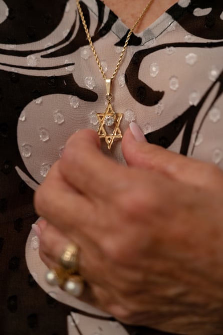 Lewis holds a Star of David necklace with a diamond that belonged to her paternal grandmother.