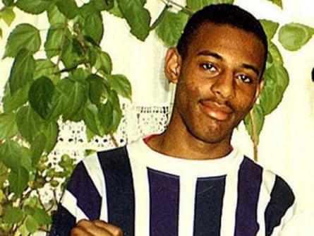 The famous picture of Stephen Lawrence in a blue and white striped top with a plant behind him