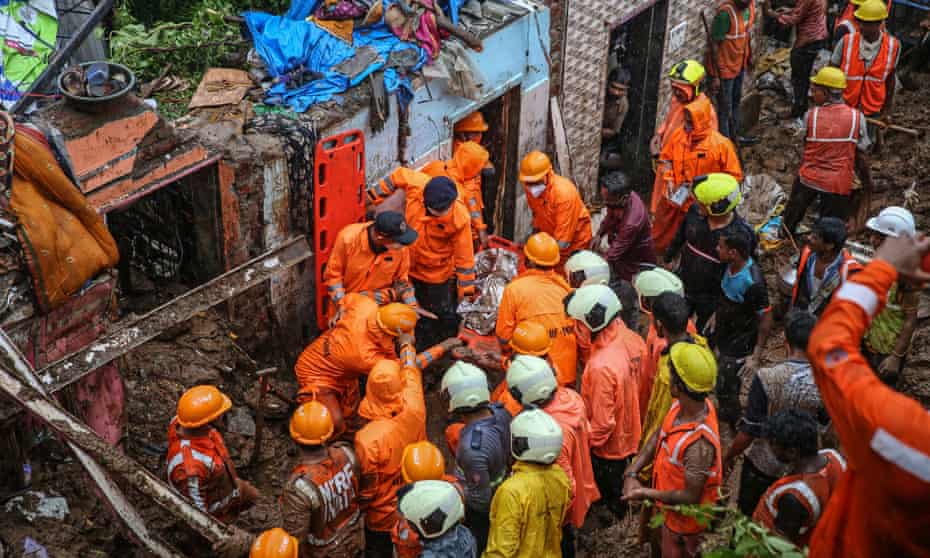 National Disaster Response Force personnel recover dead body from the rubble during a rescue operation in the aftermath of a landslide at a Bharat Nagar slum in Chembur, Mumbai