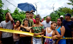 People look on near the wreckage in Boyeros, about 12 miles south of Havana.