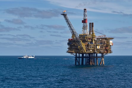 A boat moves past the Gannet A Oil Platform in the North Sea.