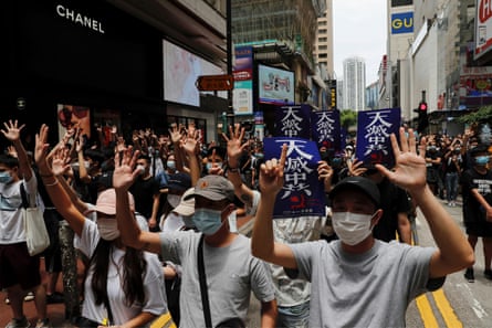 Anti-government protesters walk through the streets of Hong Kong.