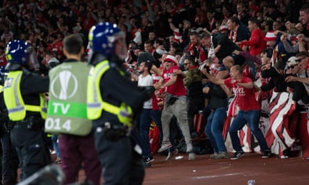 Cologne fans celebrate their opening goal by spilling over the barriers at the Emirates.