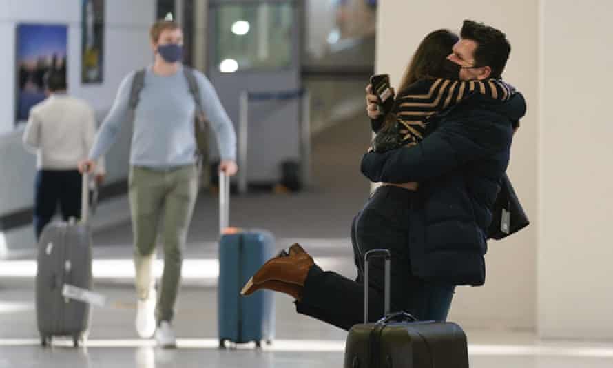 Natalia Abrahao is lifted up by her fiancé Mark Ogertsehnig as they greet one another at Newark airport on Monday