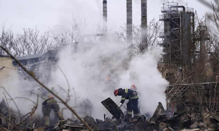 Ukrainian firefighters work at a scene of a destroyed building after shelling in Odesa, Ukraine, on Sunday.
