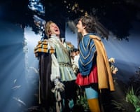 Light angles through the trees behind Oliver Savile and Rhys Whitfield in Into the Woods.