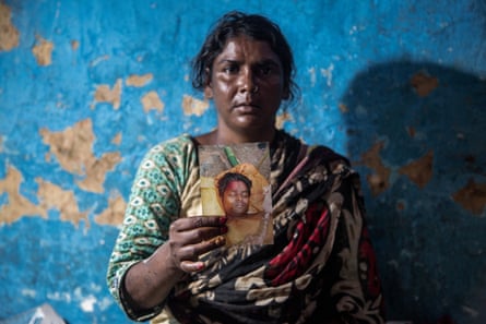 Beauty Devi showing a picture of her husband