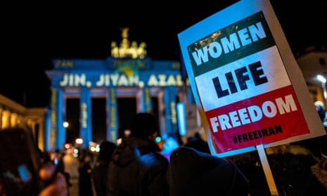 A ‘Women, Life, Freedom’ placard during a rally in support of protesters in Iran, in front of the Brandenburg Gate in Berlin.