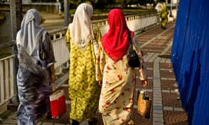 Malaysian women walk in the capital Kuala Lumpur