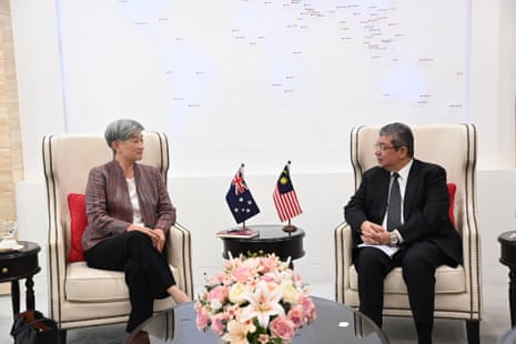 Penny Wong speaks with Malaysian foreign minister Saifuddin Abdullah in Putrajaya, Malaysia