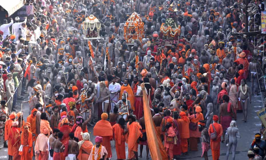 Indian holy men, or Naga Sadhu, make their way to take a holy dip in the Ganges River during the Kumbh Mela at Haridwar, Uttarakhand, India, on 14 April.