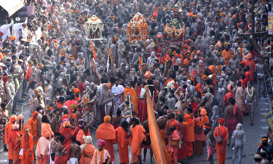 Indian holy men, or Naga Sadhu, make their way to take a holy dip in the Ganges River during the Kumbh Mela at Haridwar, Uttarakhand, India, on 14 April.