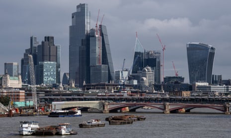 Office buildings in the City of London loom over the River Thames in September 2022 in London, England.