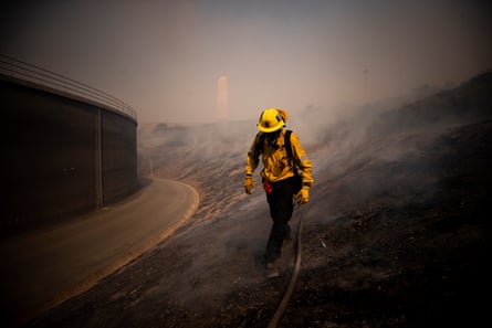Firefighters work to control the Silverado fire near Irvine, California, on 26 October.