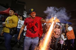 Devotees of Santa Muerte set off fireworks as they visit her shrine in the Tepito neighbourhood