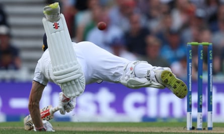 Chris Woakes scrambles to get back into his crease.