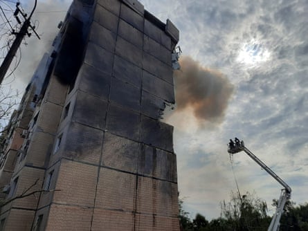 Emergency workers inspect damage to a building in Kryvyi Rih.