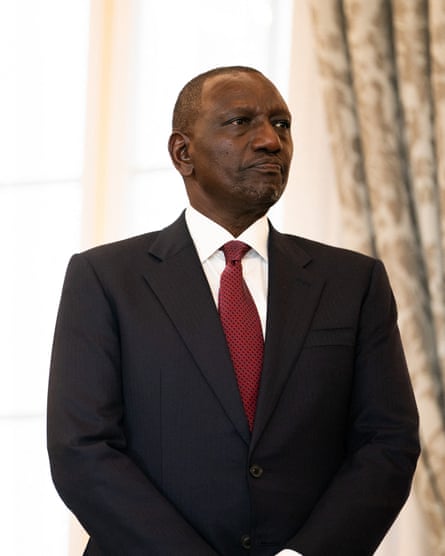 A middle-aged African man in a suit