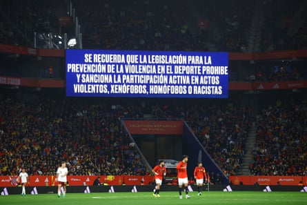 A big screen displays an anti-discrimination message during Spain’s game against Egypt.
