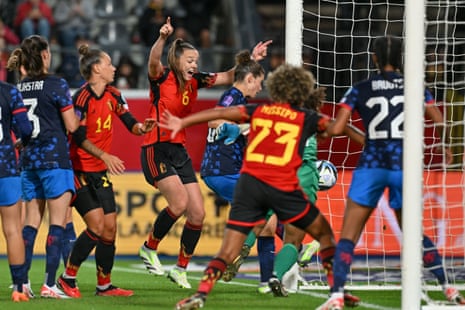 Tine De Caigny (no 6) celebrates after Jassina Blom (no 14) forced the ball home during stoppage time to put Belgium 2-1 up against the Netherlands.