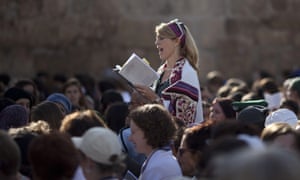 <small> A Jewish woman prays at the Western Wall 