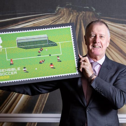 England 1966 hat-trick hero Geoff Hurst holding the Sociable Soccer postage stamp
