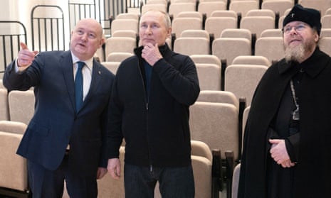 Vladimir Putin, centre, during his visit to Sevastopol, Crimea, on Saturday