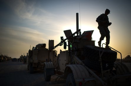 A US soldier inspects preparations for the last US convoy to leave Iraq from Camp Adder on the outskirts of the southern Iraqi city of Nasiriyah in 2011.