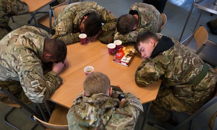Soldiers from 2 LANCS resting for a few minutes awaiting the next task after the army was brought in to assist.