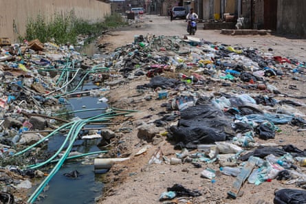 20 July 2019. Portable water pipes mix with sewage at a garbage dump in Basra, southeast of Baghdad, Iraq.