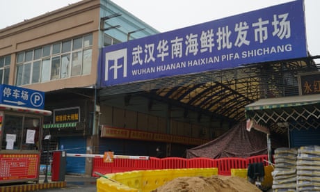 The Wuhan Huanan Wholesale Seafood Market, where a number of people related to the market fell ill with a virus, sits closed in Wuhan, China, Tuesday, Jan. 21, 2020. Heightened precautions were being taken in China and elsewhere Tuesday as governments strove to control the outbreak of the coronavirus, which threatens to grow during the Lunar New Year travel rush. (AP Photo/Dake Kang)