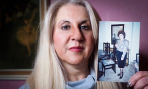 Annabella Bell with a photograph of her mother, who was murdered by her husband