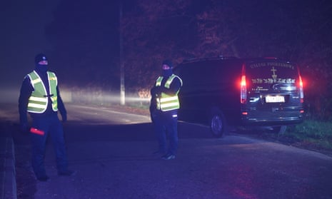 Police officers secure access to the site of the explosion in the village of Przewodów, Poland.