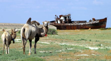A rusty shipwreck on the dried-up seabed of the Aral Sea.