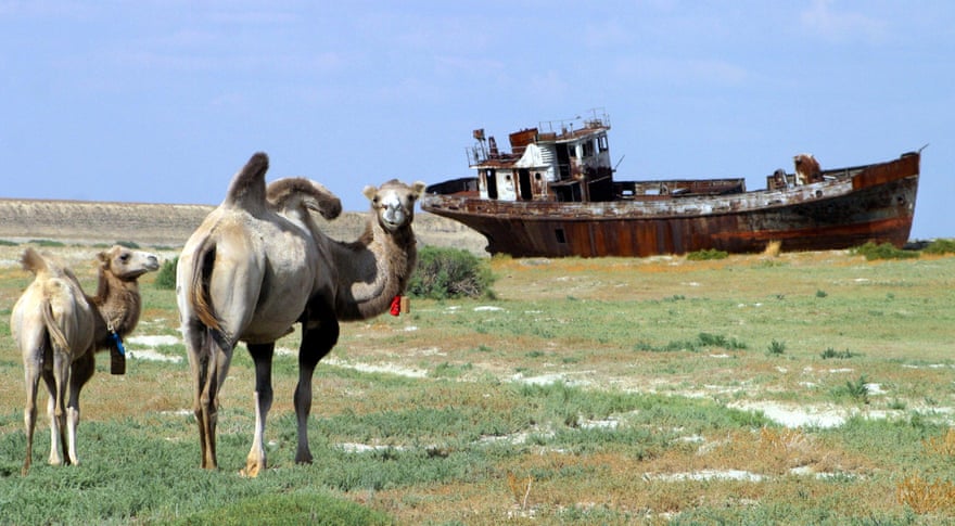A rusty shipwreck on the dried-up seabed of the Aral Sea.