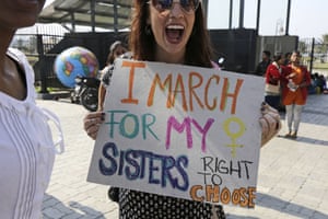 An activist holds a placard during a rally in Kolkata, India