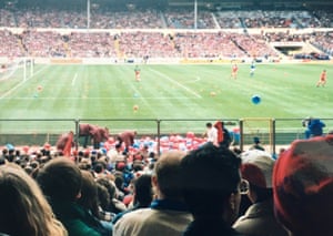 Stewards deal with the many red and blue balloons that the Crystal Palace fans brought to the 1991 Zenith Data Cup final at Wembley Stadium.