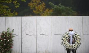 A US park ranger moves a memorial wreath on 11 September 2020 in Shanksville, Pennsylvania.