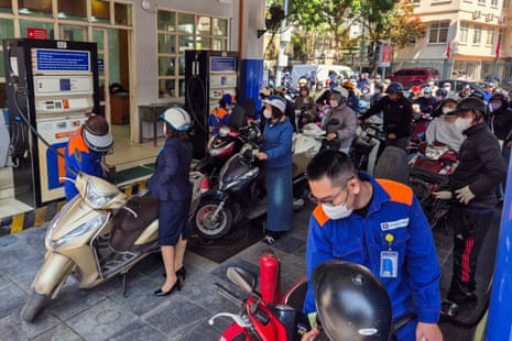 People queue to buy petrol at a petrol station after Vietnam's trade ministry called on local businesses to encourage their employees to work from home to save fuel amid disruptions in supply and price surges triggered by the US-Israeli conflict with Iran, in Hanoi, Vietnam, 10 March 2026.