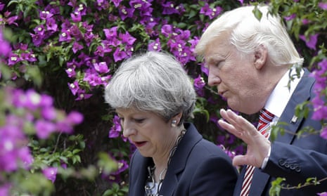Theresa May talks to Donald Trump at the G7 summit in Sicily.