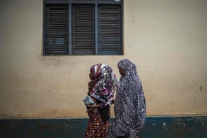 Women arrive for Friday prayers at the mosque in Pemba