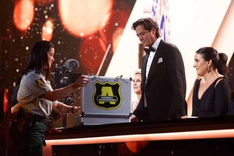 Gillon McLachlan, Chief Executive Officer of the AFL is seen opening the votes during the 2023 Brownlow Medal at Crown Palladium.