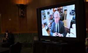 United States senators listen to Dr Anthony Fauci speak remotely on Capitol Hill in Washington DC Tuesday.