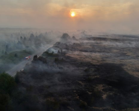 A drone view shows smoke rising from burnt fields and forests during a wildfire near Waimes, in the High Fens (Hautes Fagnes) region, Belgium.