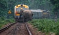 A busy commuter train comes to a halt inches away from an elephant on the track in West Bengal