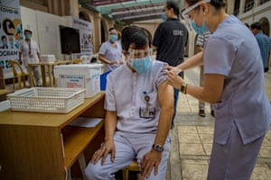 Health workers take part in a mock Covid-19 vaccination drill at the Philippine General Hospital on 15 February