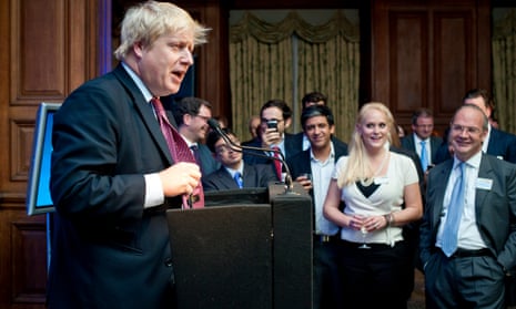 Boris Johnson speaking at a summit in October 2001 with Jennifer Arcuri looking on