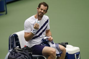 Andy Murray pulls off his face mask before playing against Yoshihito Nishioka.