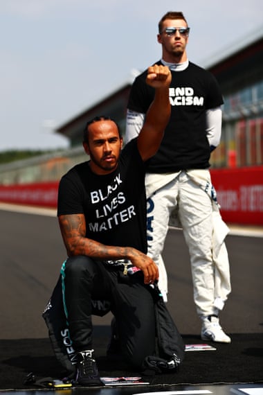 Lewis Hamilton takes the knee before the 70th anniversary grand prix at Silverstone, Northamptonshire, in August