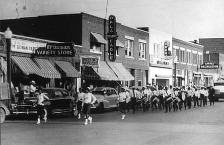 A shopping parade on Greenwood Avenue in the 1930s or 40s. Among the visible businesses are the offices of the Oklahoma Eagle newspaper.
